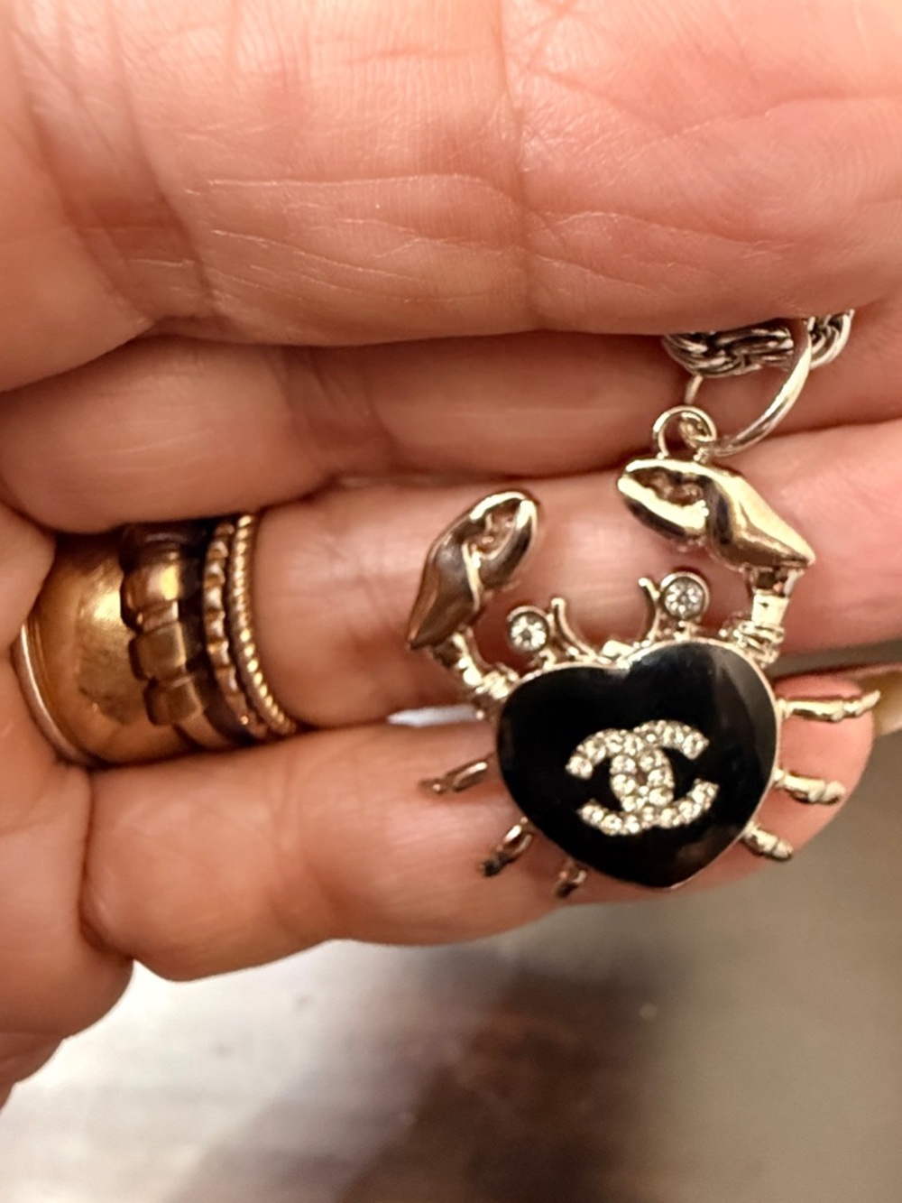 Chanel Silver-Tone stamped Crab in black 
enamel & Chrystal
on 19" twist rope